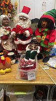Group view of dolls, plush turkey, ribbons tub