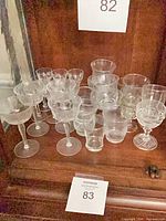 Overall view of assorted glasses on cabinet