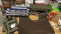 Overall view of assorted collapsible organizers, hampers and travel bag on table