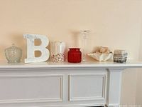 All seven decorative pieces aligned on mantle