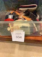 Front view of bin showing assorted hair combs