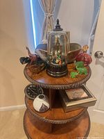 All items arranged on tiered table showing overall lot contents