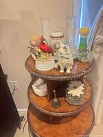 overview of three-tier table with assorted decor items