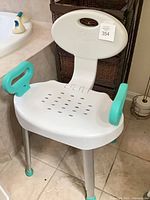 Full view of Carex shower chair showing seat, backrest, armrests, legs