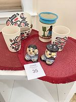 Full lot view showing bowl, tumblers, vase, shakers