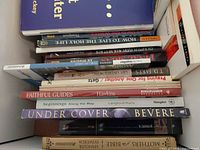 Box of mixed Christian books showing spines such as Faithful Guides, Under Cover, Mothers Study Bible