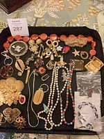 Full tray view of assorted costume jewelry pieces