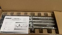 Instruction sheet and wrapped light stakes inside box