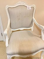 Front view of armchair showing frame and upholstery