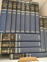 Group of Lockyer blue hardcovers standing upright on shelf