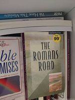 Spines and front covers showing The Romans Road, Bible Promises, Preparing Expository Sermons plus additional unidentified books