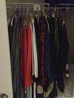 Closet rod with multiple garments in mixed colors and styles