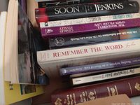Stack of books showing multiple titles and formats