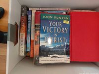 Top view showing John Bunyan title and mix of books