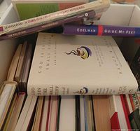 Open box of assorted religion and self-help books