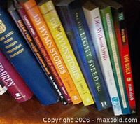 Top shelf showing blue ‘The Purpose Driven Church’, two ‘101 Hymn Stories’, ‘Light Speed Bible’, ‘Life Without Limits’ and red ‘The Bible’