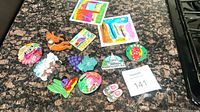 All ten assorted fridge magnets displayed on countertop