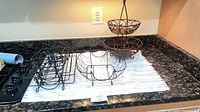 Countertop view showing tier stand and three loose wire baskets