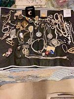 Overall view of all jewelry laid on black fabric