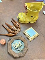 All items in lot: ceramic boot planter, wood utensils with stand, framed mirror, shadowbox, candle