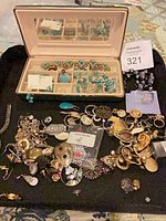 overall view of jewelry spread and box