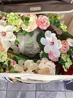 Top view of Kano storage bin showing wreath with mixed artificial flowers