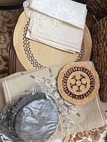 Assortment showing napkins, straw placemat, coaster, table runner, and bagged felt discs