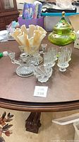 all six glass items grouped on table