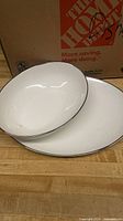 Dinner plate and bowl showing color, pattern, and silver rim