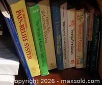 Shelf view of assorted parenting, religion and education paperbacks