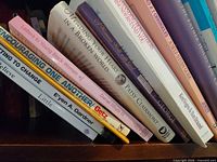 Shelf of angled paperback spines featuring titles Mending Your Heart in a Broken World, Encouraging One Another!, Letters to Young Black Women