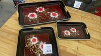 All three floral metal trays showing sizes and design