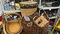 Group shot showing hamper with lid, large handled basket, oval baskets and tissue box cover
