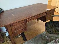 Full view of desk surface and chair side