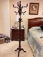 Full view of mahogany hall tree coat rack showing height and overall design