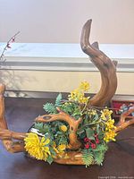Planter base with faux florals visible