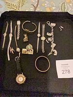 All items on black tray showing overall lot