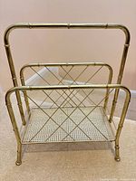 Front view of brass magazine rack