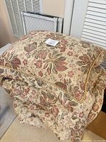 Stack showing decorative pillow on matching sham, overall design visible