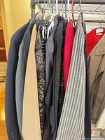 Rack displaying blazers, jackets and coats in assorted colors