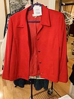 Front view red blazer on rack