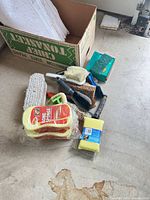 Group of sponges, brushes and scrubbers on floor