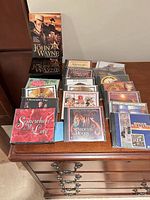 Overview of CDs on dresser and John Wayne DVD box