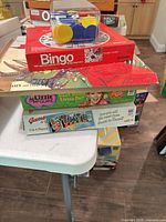 Stack showing Bingo, Dinosaur, Lizzie McGuire and Game of the States boxes
