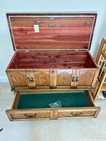 Hope chest open showing cedar interior, felt-lined drawer extended