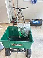 LESCO CommercialPlus push spreader with sealed hopper cover in hopper