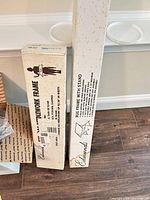 Two unopened Edmunds frame boxes standing upright