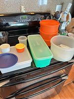 Overview of all containers and lids on stove