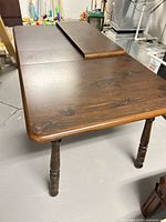 Full view of table with leaf partially inserted