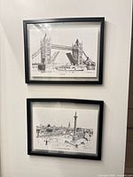 Both framed London landmark prints hung on wall
